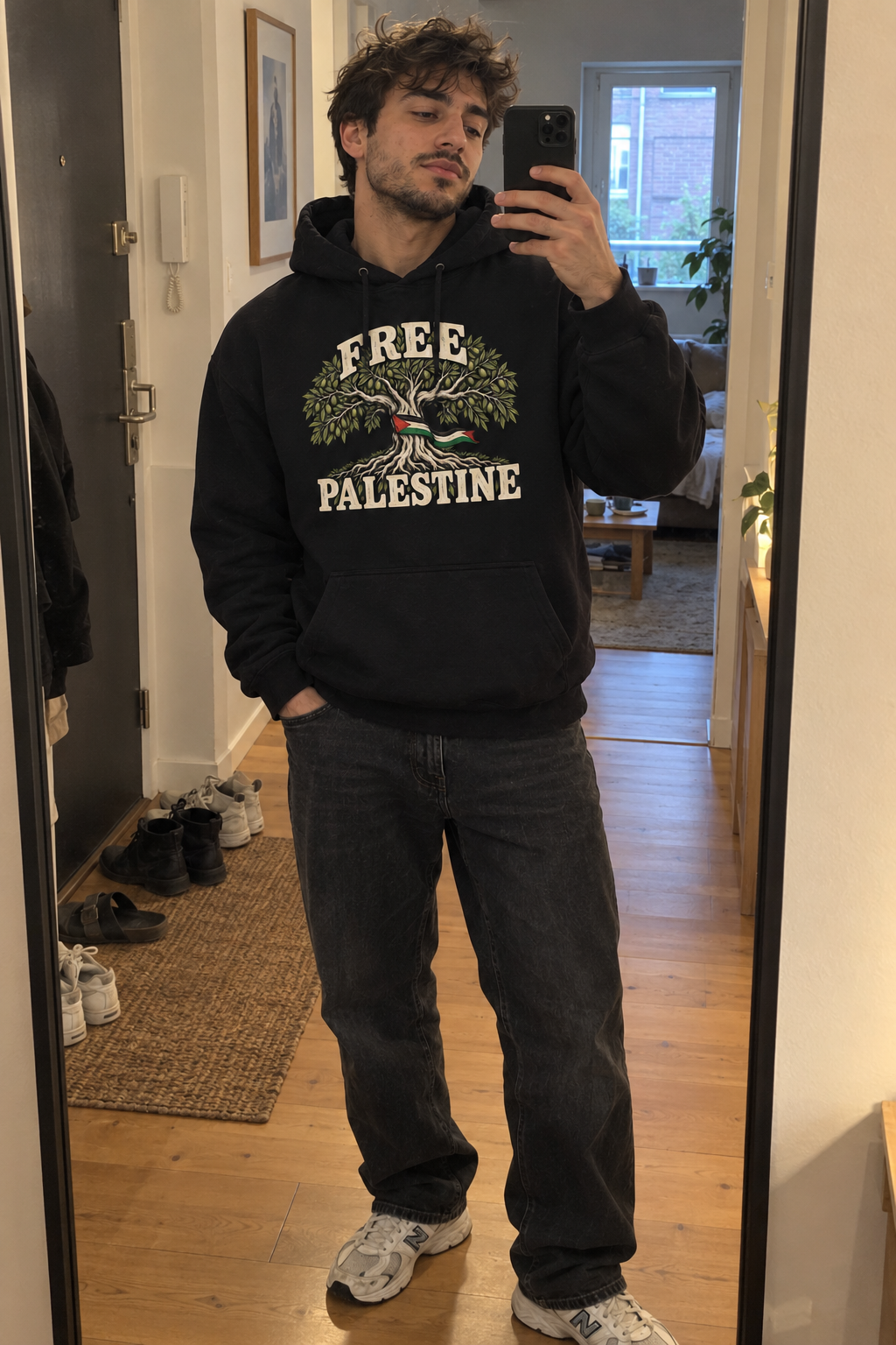 AI lifestyle visual: black Free Palestine hoodie as a mirror selfie